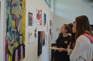 Students view artwork exhibited at the Voices art show on June 6.  Quinn Kropschot/ La Vista