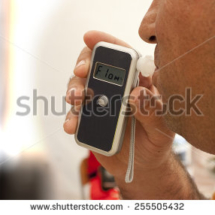 stock-photo-alcohol-testing-man-blowing-in-breathalyzer-255505432