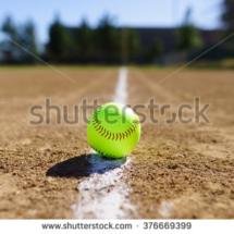 stock-photo-softball-in-a-softball-field-in-california-mountains-on-a-white-line-376669399