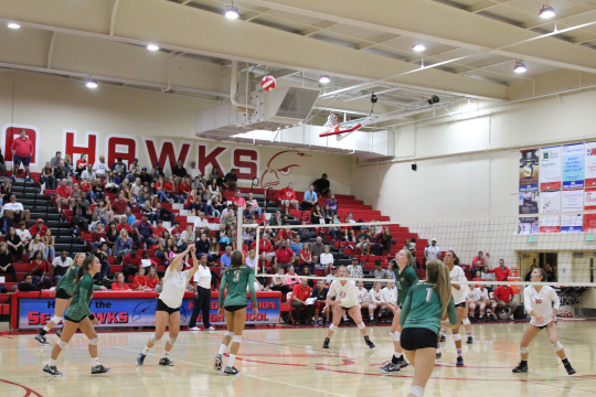 Junior Kelli Barry sets Hannah Scott for an outside attack during the 2nd game.