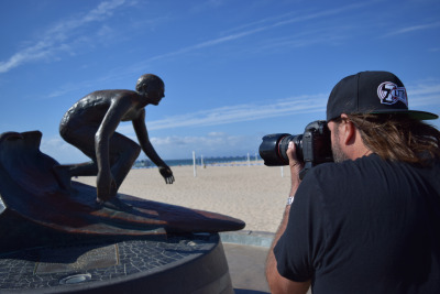Broza photographs the distinctive Tim Kelly statue located at the base of the Hermosa Beach Pier. 