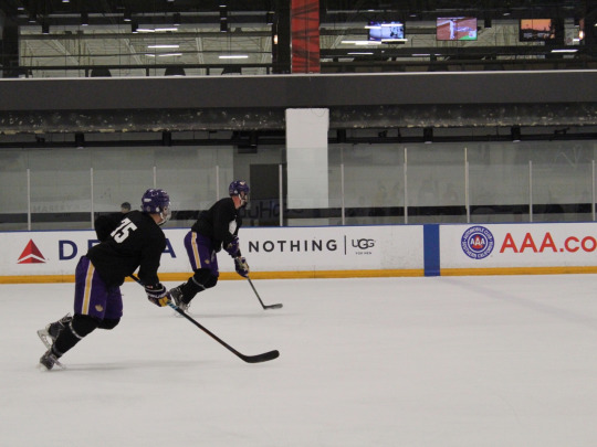 Cade and his teammate race from goal to goal to work on their endurance and speed.