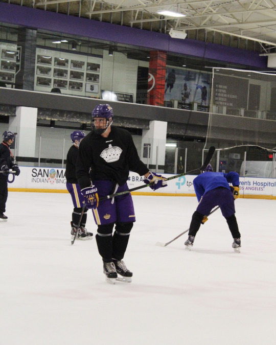 Cade waits readily for his teammates to bring the puck back to his side of the court.