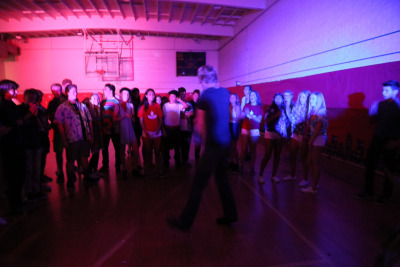 Senior Connor Tree breakdances in the center of a dance circle during the Homecoming dance at Costa Saturday night. 