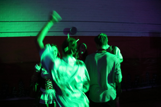 Senior Jackie Soliman dances to music with friends while dressed as a Japanese person for the Homecoming dance the night of October 14th.  