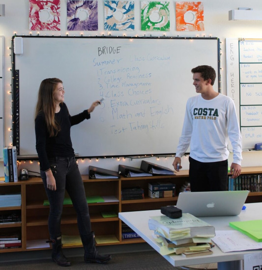 Senior Kalea Frank and Todd presents the curriculum that the program follows in order to help them prepare for high school. 