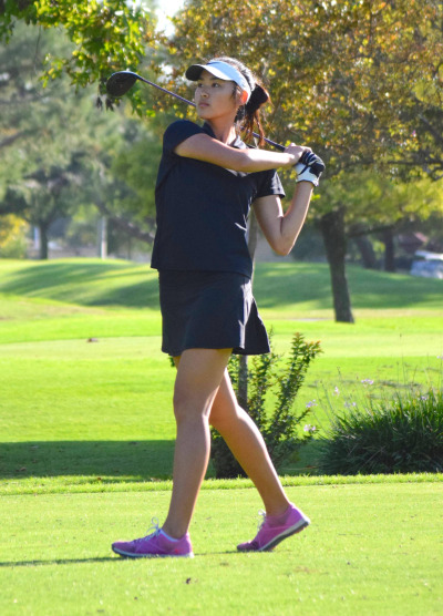 JV player Lauren Chao goes Varsity for League Finals, driving the ball from the fairway on the 10th hole.