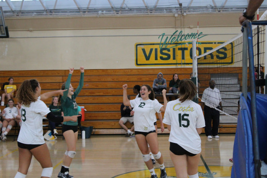 Sophomores Emily Dubinsky, Malea Stanton, Sami Underwood and Senior Amanda Montag celebrate the match’s win. 