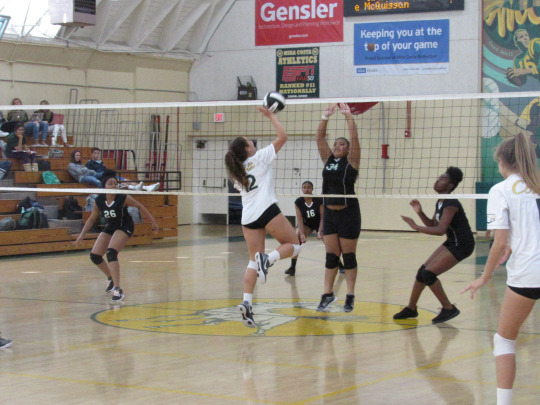 Junior Emily Dubinsky hits the ball, adding another point to the Mira Costa Girls Varsity Volleyball’s score.