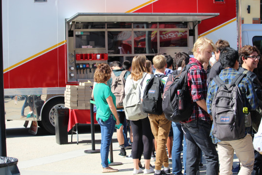 Honor Roll students wait in the long line to get the free In-N-Out lunch they have earned.