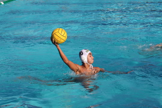 Sophomore, Colin Le, raises the ball high in the air looking around for an open teammate. 