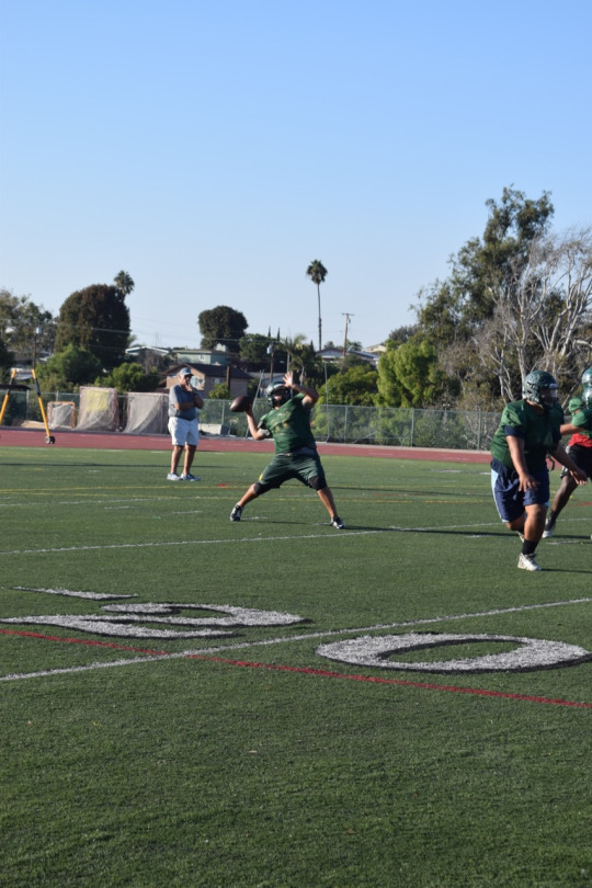 Sophomore quarterback Reed Vabrey throws the football to a wide receiver during Varsity football practice on Wednesday. 