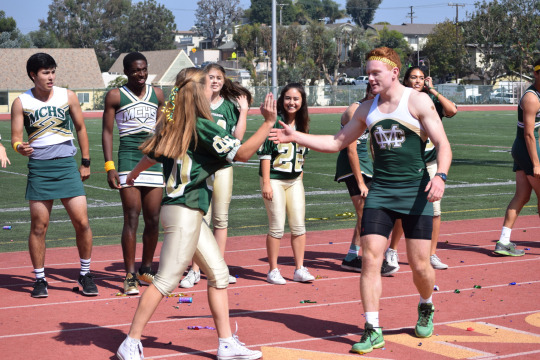 Nominees of the homecoming court, Hogan Webb and Delaney Whittet perform their duet in front of Costa students.