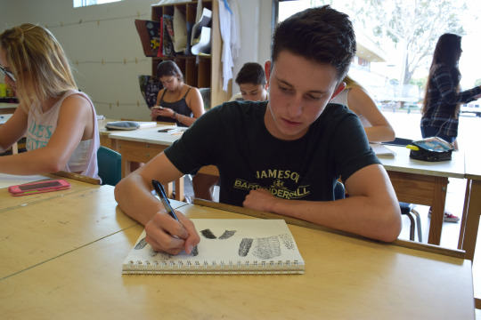 Junior Ty Dilman practices his ability to draw different textures during his 5th period art class on Tuesday.  The ability to draw textures is important to artists like Ty who want their work to stand out.