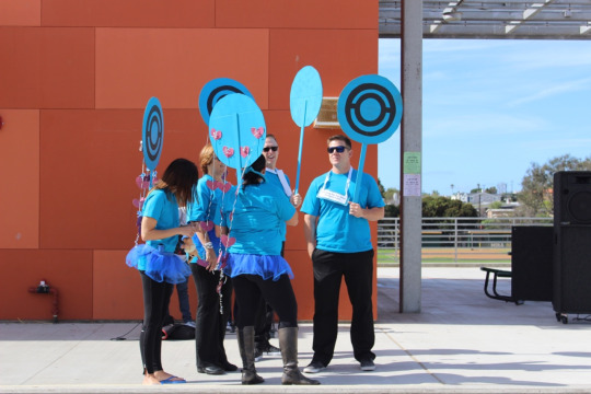 Principal Ben Dale, and other faculty members stand on the Mustang Mall stage and await the upcoming Halloween costume contest during lunch. The contest took place at the beginning of break, and recognized multiple students with unique costumes.