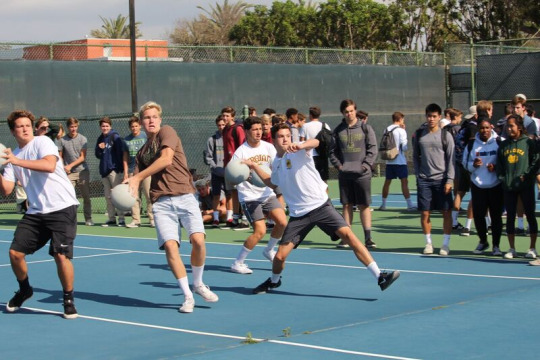 The Mira Costa Water Polo Seniors ( L- R : Garrett Weatherly, Christian Thornton, Trevor Todd, Lucas Brannan) prepare a powerful throw against the opposing team during the Semi-Finals match. The Water Polo Seniors were defeated in the Semi-Finals match, thus unable to move on to the next round.