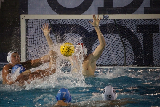 Junior Goalie Paul Matt blocks a shot made by Corona Del Mar during the second half of the game. 