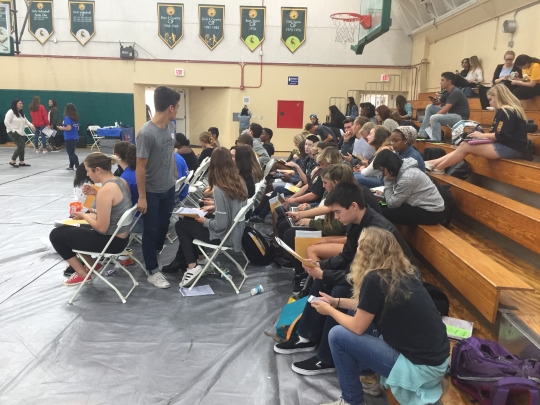 A collection of students wait to donate blood in Fisher Gymnasium on November 26th during PM Office Hours.
