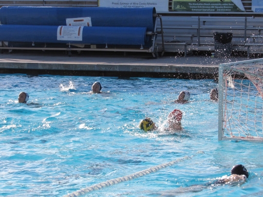 Mira Costa Senior Allie King has her shot blocked during a routine scrimmage at a Mira Costa Girls Varsity Practice after school. The Girls began their season following the end of the Mira Costa Boys, and they practice at the pool everyday after school.