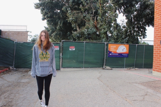 Sophomore Amanda Mcdonald, along with many other Costa students, struggle to get to and from their cars parked on meadows street due to the new renovation of the lower field. The construction began about 3 weeks ago.