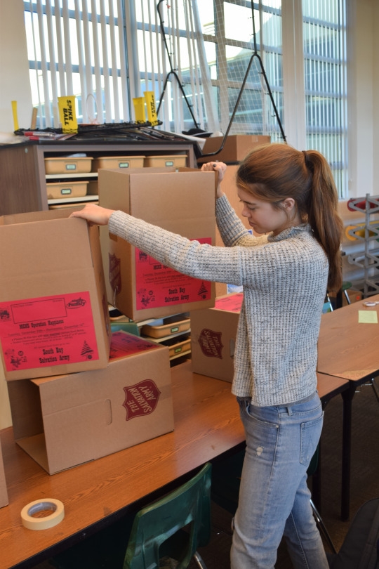 Senior ASB member Kalea Frank constructs and organizes a collection boxes in the ASB room during fifth period for this year’s Salvation Army Canned Food Drive. The food drive began the week of December 5th and will end on the 15th.