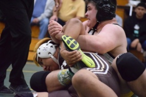 With the team score tied 33-33, Varsity Heavy-weight Joe Gebele puts in a half nelson, however his opponent got a reversal and took the win for the Warriors late in the third period.