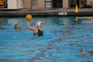 Senior Kate Dixon prepares to shoot the ball at the Water polo game at Capo Valley High School.
