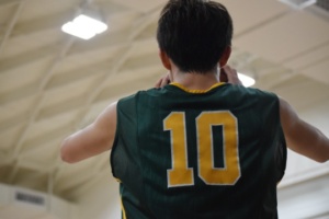 Junior Bobby Barkley in-bounds the ball from the baseline in Tuesday’s boys basketball game against Torrance High School.