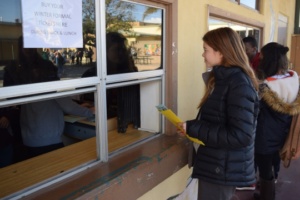 Senior Kalea Frank buys tickets to this year’s Winter Formal at the student store during lunch on Thursday. Ticket prices were lowered this year, but prices for tickets will again rise after Friday, January 20th.