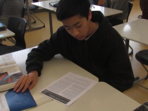 Junior Peter Lu reads a packet on modified genes while in Miss Bledsoe’s class this Monday during 1st period. Students in Miss Bledsoe’s AP Biology class were told to read this packet and then answer questions on the sections they read to learn more about genetics. 