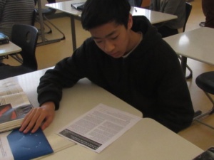 Junior Peter Lu reads a packet on modified genes while in Miss Bledsoe’s class this Monday during 1st period. Students in Miss Bledsoe’s AP Biology class were told to read this packet and then answer questions on the sections they read to learn more about genetics. 