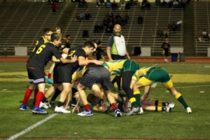 One of the teammates successful hand off the ball to another player.