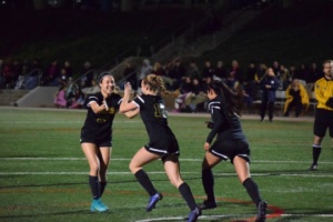 Seniors Allison Roth (Left), Delaney Whittet (Middle), and Viviana Villacorta (Right) celebrate Whittet’s goal that tightened the score to 4-2.