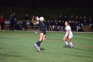 Senior Emelie Flaig takes a touch off her chest to settle the ball in Mira Costa’s 5-2 loss to Redondo on the night of Tuesday, January 24th at Redondo Union High School.