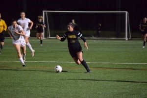 Senior Viviana Villacorta soars past Redondo defenders, only to miss the net by a small margin moments later.