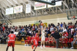 Junior Bobby Barkley shoot a three pointer in the first half of the game on Tuesday night against Redondo. 