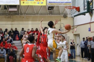 Junior Morgan Clark goes to shoot a layup and get Costa the point against Redondo.