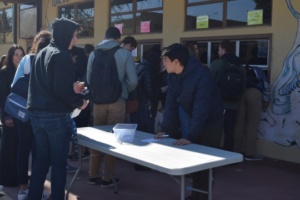 Senior James Marsh registers for his AP tests at the student store during lunch on Thursday, January 26th. Students were able to purchase AP exams and Winter Formal tickets at the student store.