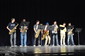 The group of saxophone players performs during the second act of the talent show on January 26th.
