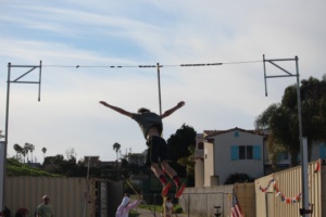 Nicosia gracefully begins his descent onto the mat below, after performing a successful vault.