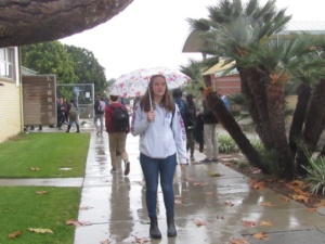 Junior Geena Radville as well as other Mira Costa High School students use umbrellas to stay dry this Monday during lunch. Today is rained nearly all day, forcing students to use umbrellas and hoods to stay dry while walking in the rain. 
