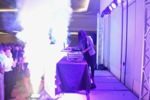 The DJ triggers a smoke cannon effect to eject fog from both sides of the stage. Smoke effects were combined with colorful lighting and a variety of dance songs to create an entertaining atmosphere for students to enjoy.