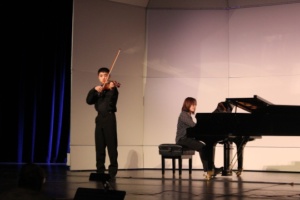 Freshman Eric Hei plays the violin at the Rotary Solo Finals on Friday. He was the opening performer of the night. 