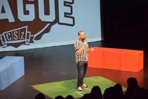 The ref greets and pumps up the audience in the small theater on Friday. He explained the rules and provided commentary throughout the Comedy Sportz match.