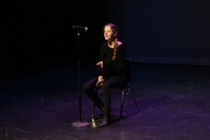 Senior Claire Layden performs a poem in the second act of the drama show. She read the poem Thinking About You by Mike Taylor.