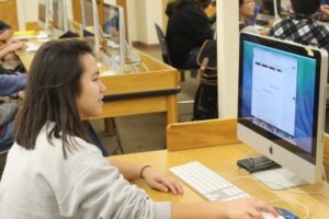 Senior Jennifer Marer, winner of the Clinton Family Social Inclusion Grant, works on her project in the Costa library. Jennifer along with sophomore Nisha Chatwani were the two student winners, they each received 5,000 dollars. 
