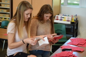 ASB junior class reps. Kara Milewski (left) and Natalia Givot (right) prepare valagrams in the ASB room Tuesday during 5th period.  Valagrams have been exchanged at Costa and have promoted a Costa-family feeling for many years.