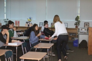 Ms. Sieker is shown above passing out valgrams to students. The roses were delivered by ASB and then distributed by teachers.