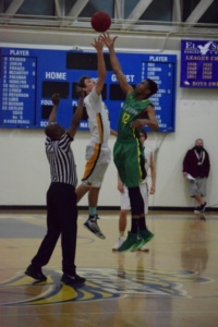 Senior Jonas Pittman jumps for the tip ball to begin Mira Costa’s first CIF game. The game took place on Friday, February 17, 2017 at El Segundo High School.