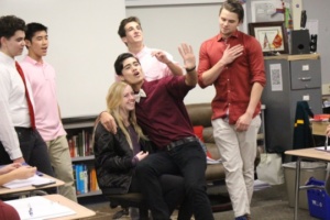 Mens Choir members Harrison Caplin (far left), Philip Wah, Max Glasman, Antonio Selitto and Max Thomas perform a valgram for senior Jenna Billingsley during her fourth period english class. Both choir and band performed these valgrams throughout the day as a valentines day tradition.